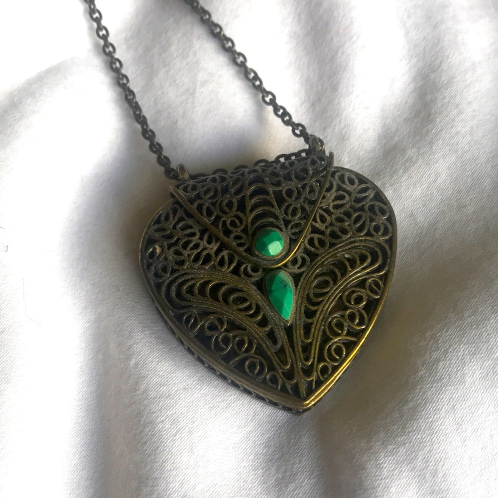 Gold locket necklace.